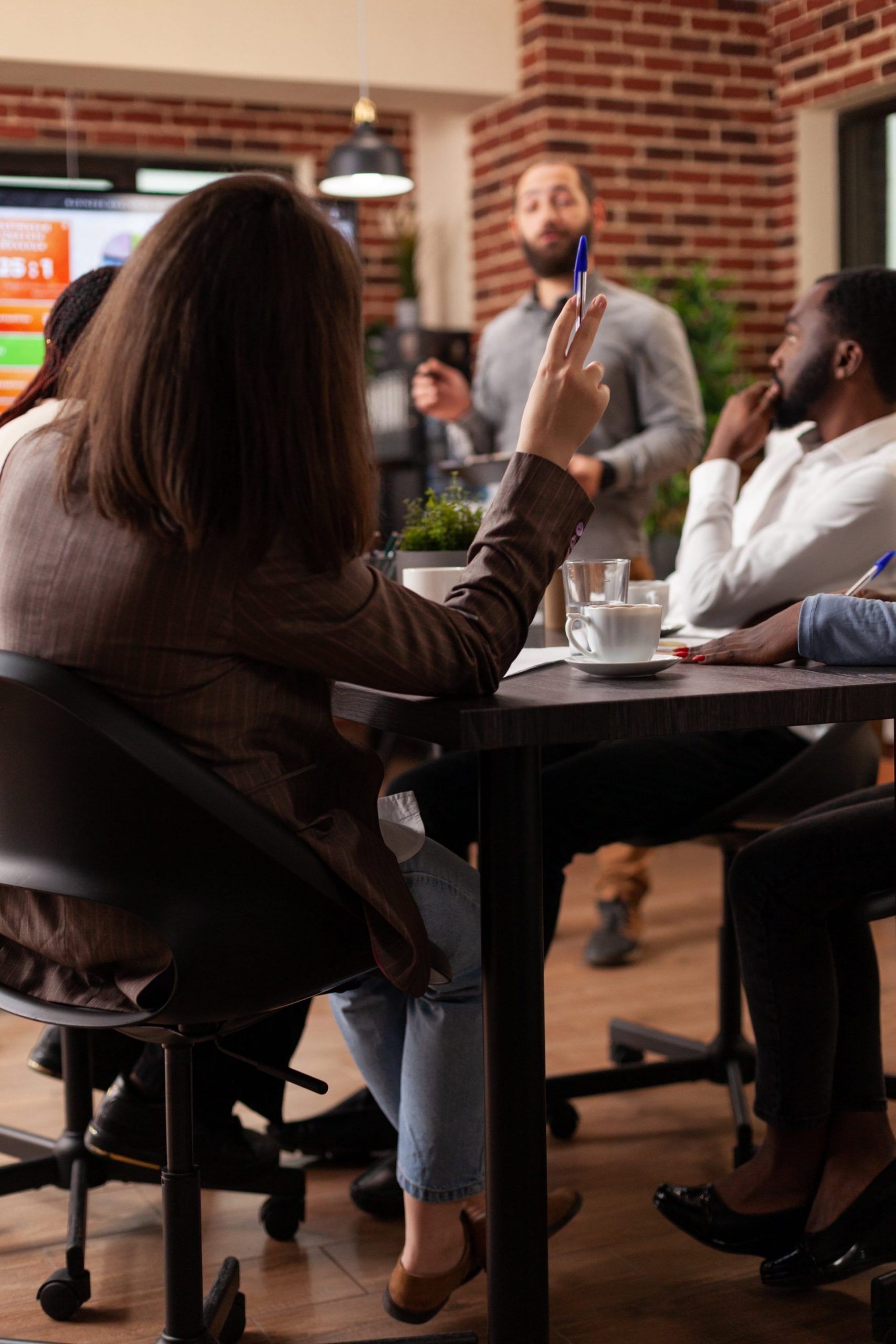meeting-question Marketer Looking at Tablet